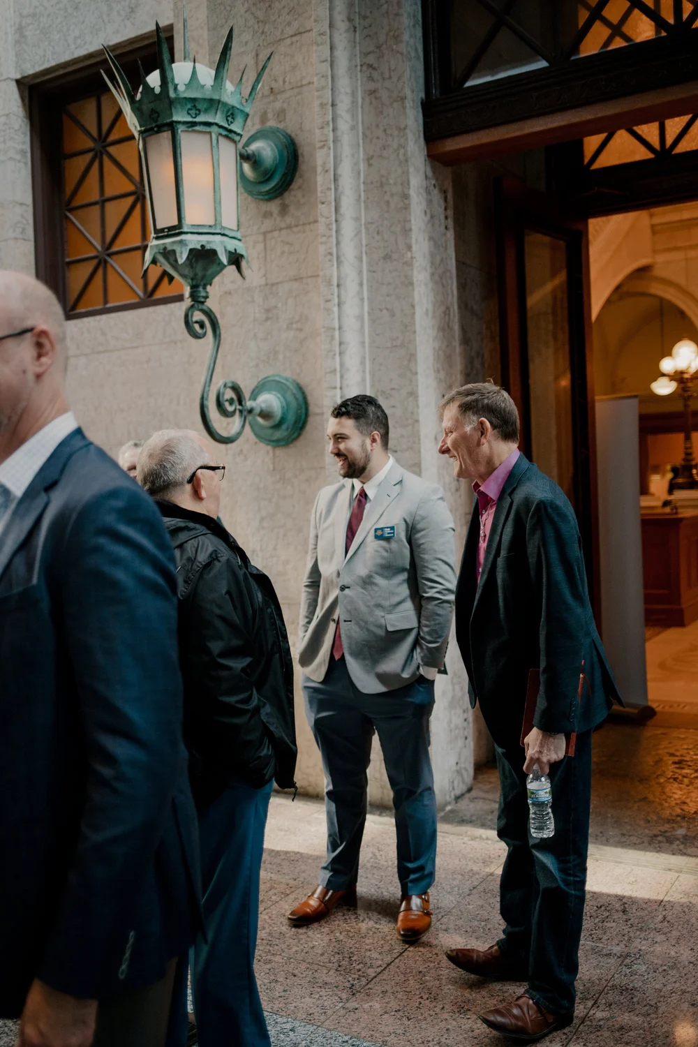 Talking, by the Statehouse doors