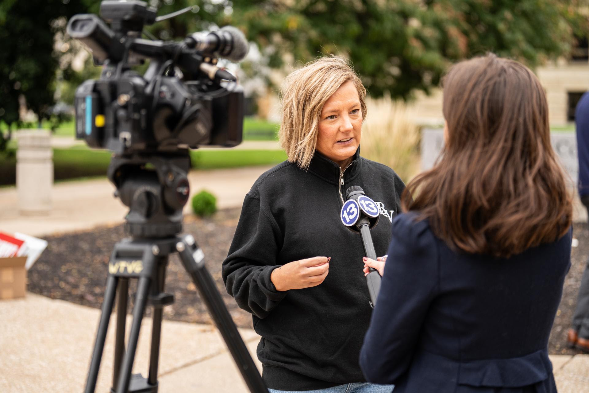 A speaker gives an interview to 13 ABC after the press conference