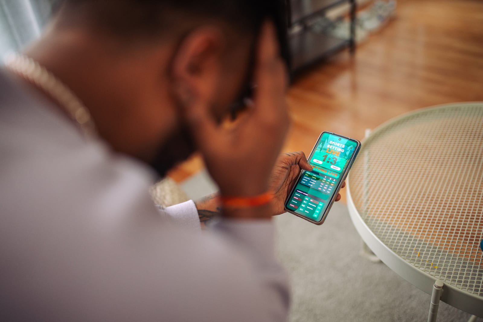 A person looks at a gambling app on a smartphone.